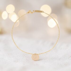 Bracciale in oro 18kt con medaglia lettera G